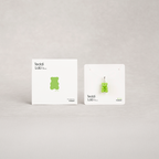 Two green gummy bear-shaped products on white cards with 'Teddi Lab' branding on a light gray background.