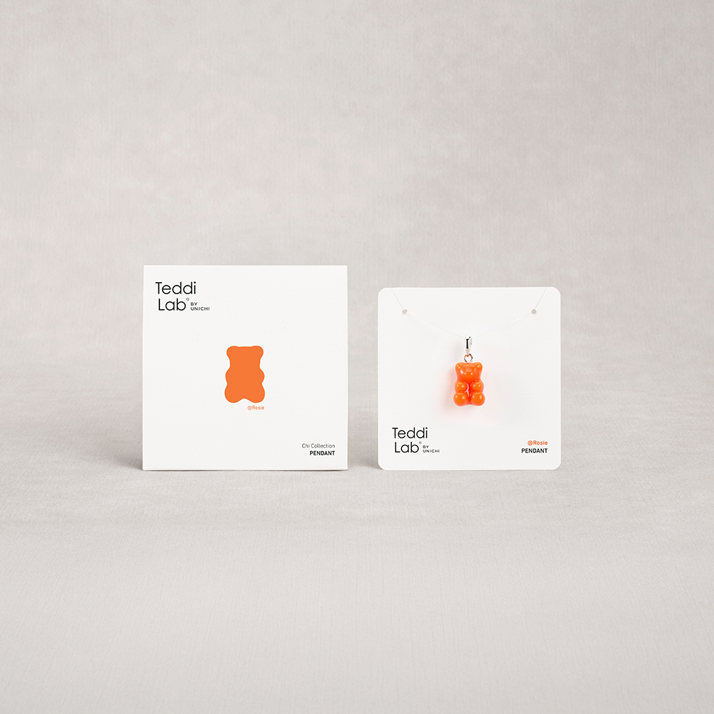 Two gummy bear-shaped earrings on display cards with 'Teddi Lab' branding on a light gray background.